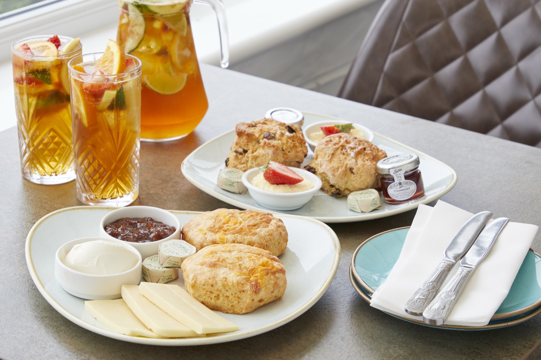 Jug of Pimm's and cream tea served with a sea view